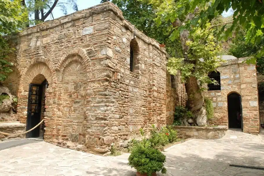 Scenic view of the House of the Virgin Mary, surrounded by lush greenery and historical architecture