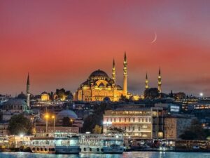 Süleymaniye Mosque in Istanbul, with its impressive domes and minarets, seen from the sea.