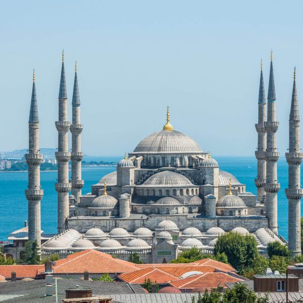 Blue Mosque in Istanbul under clear sky, showcasing its grand domes and minarets.