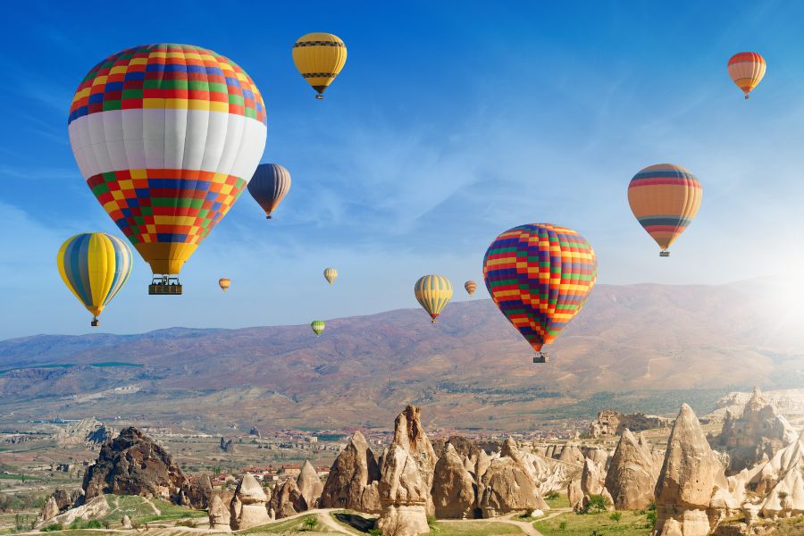 Cappadocia hot air balloon adventure - colorful balloons over unique rock formations
